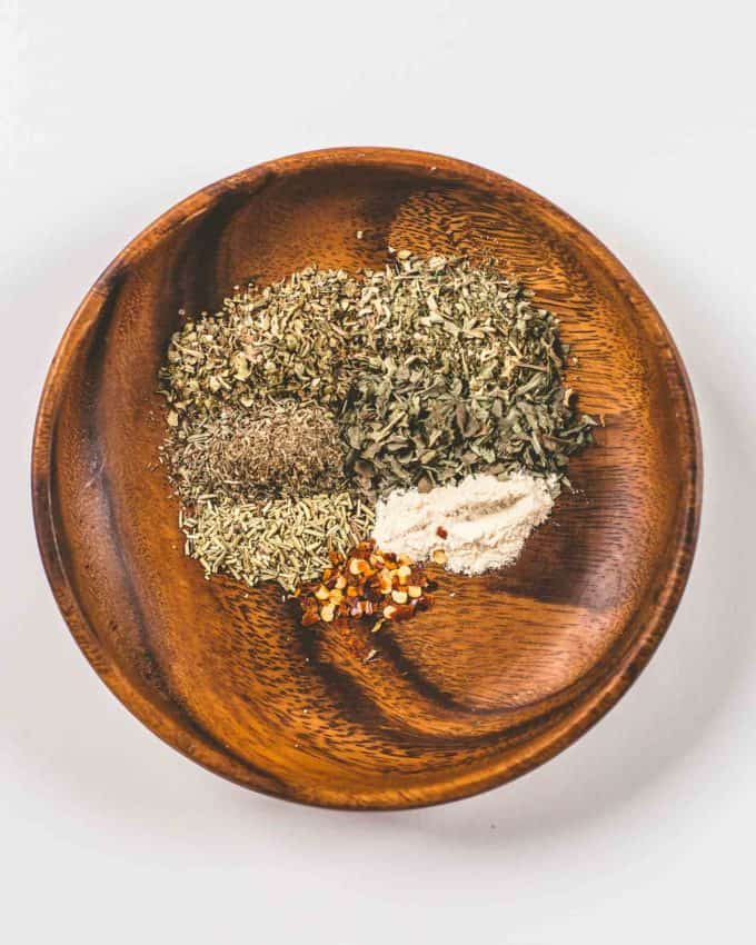 Italian Herb Seasoning ingredients in a wooden bowl