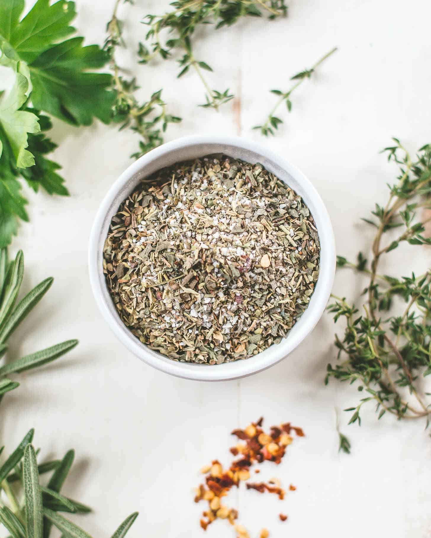 overhead image of Italian Herb Seasoning in a small white ramekin