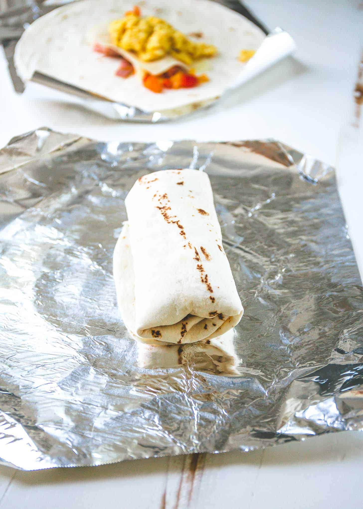 a burrito on a piece of foil