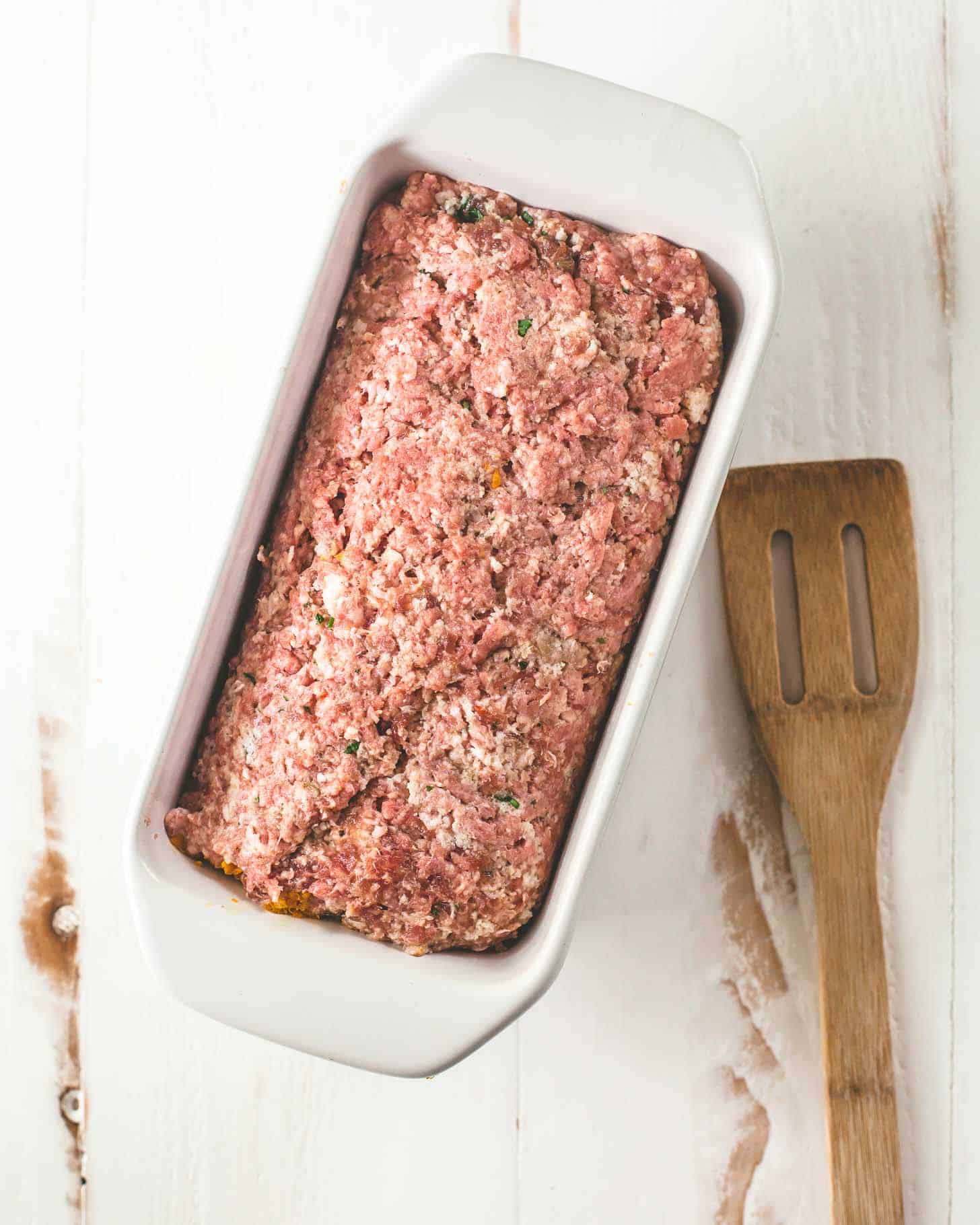 uncooked meatloaf in a loaf pan