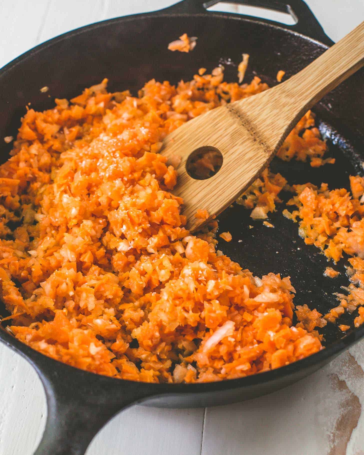 sautéing vegetables in a cast iron skillet