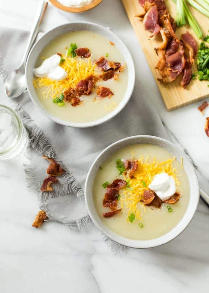 Baked Potato Soup in white bowls