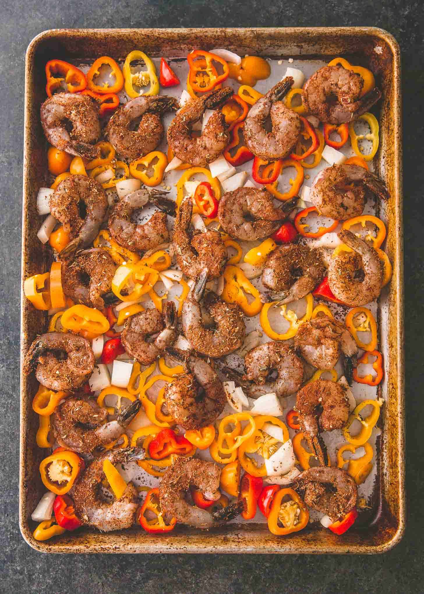 peppers, onion and shrimp on a sheet pan