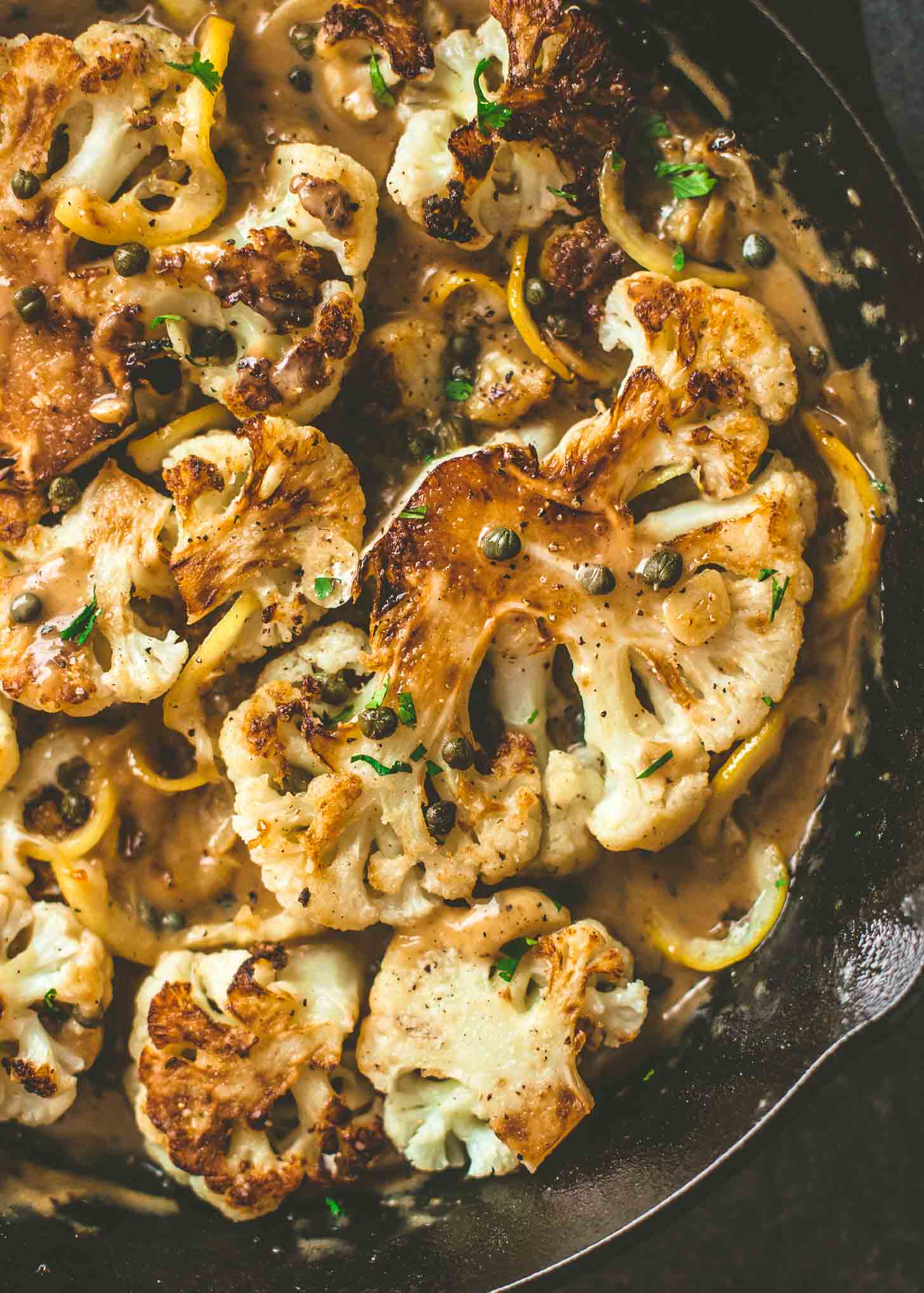 overhead image of Cauliflower Piccata with Lemon Caper Sauce in a skillet