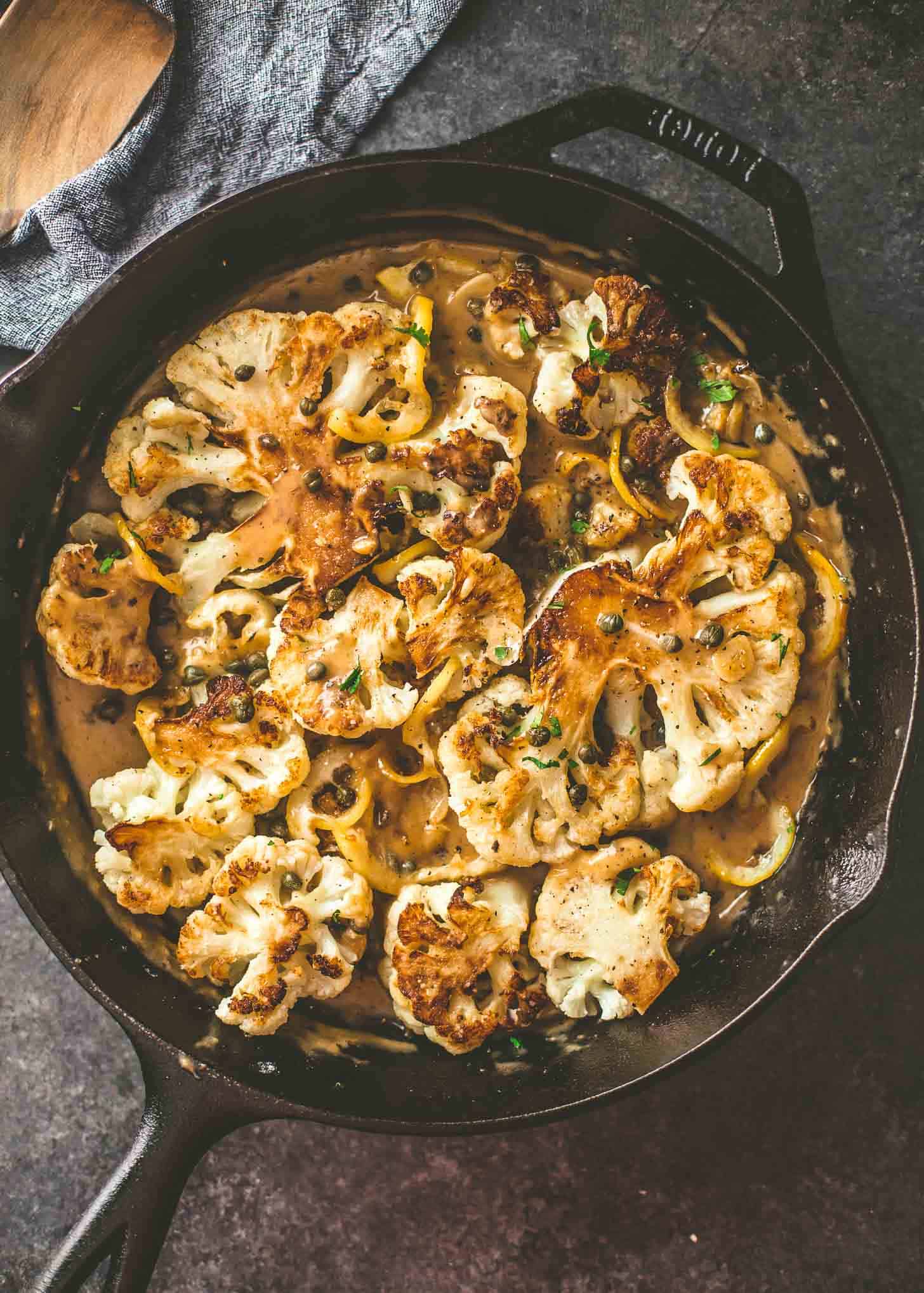 overhead image of Cauliflower Piccata with Lemon Caper Sauce in a skillet