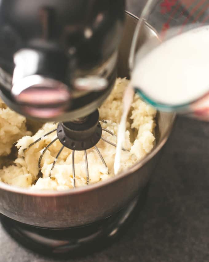 blending milk with potatoes with a mixer