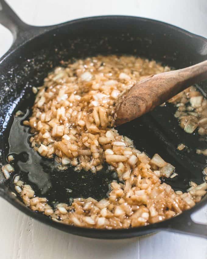 cooking onions in a skillet
