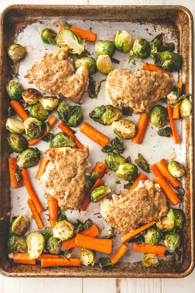 chicken, carrots and brussels sprouts on a sheet pan