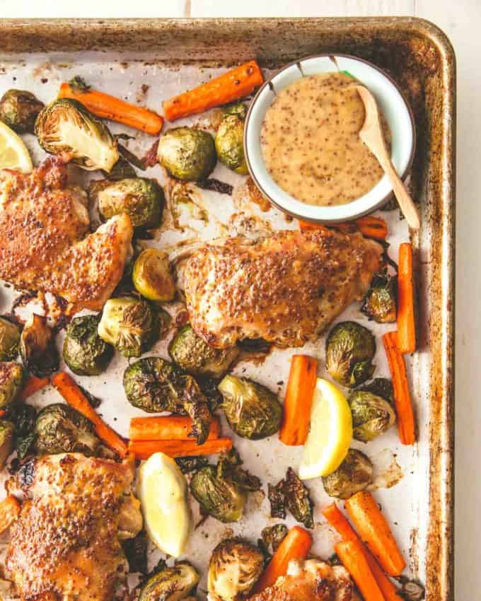 chicken, carrots, brussels sprouts, and dijon on a sheet pan