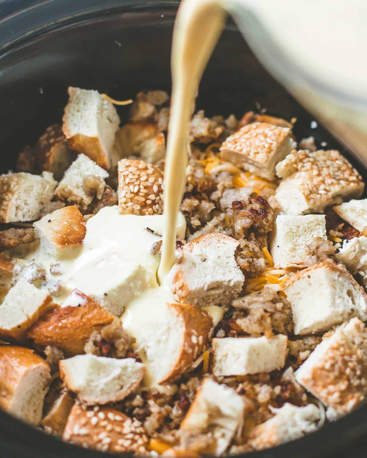 adding milk to bagels in the slow cooker