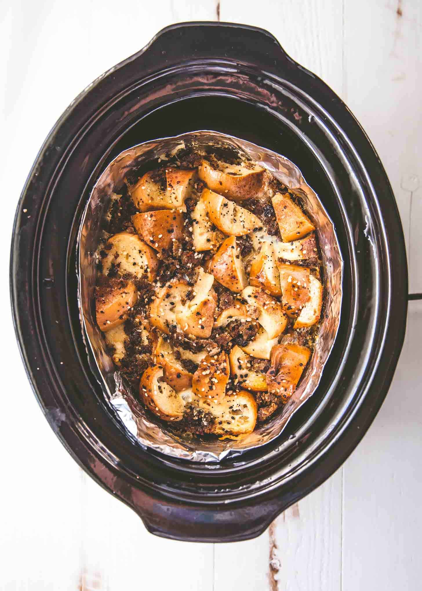 overhead image of ingredients in a foil collar in the slow cooker