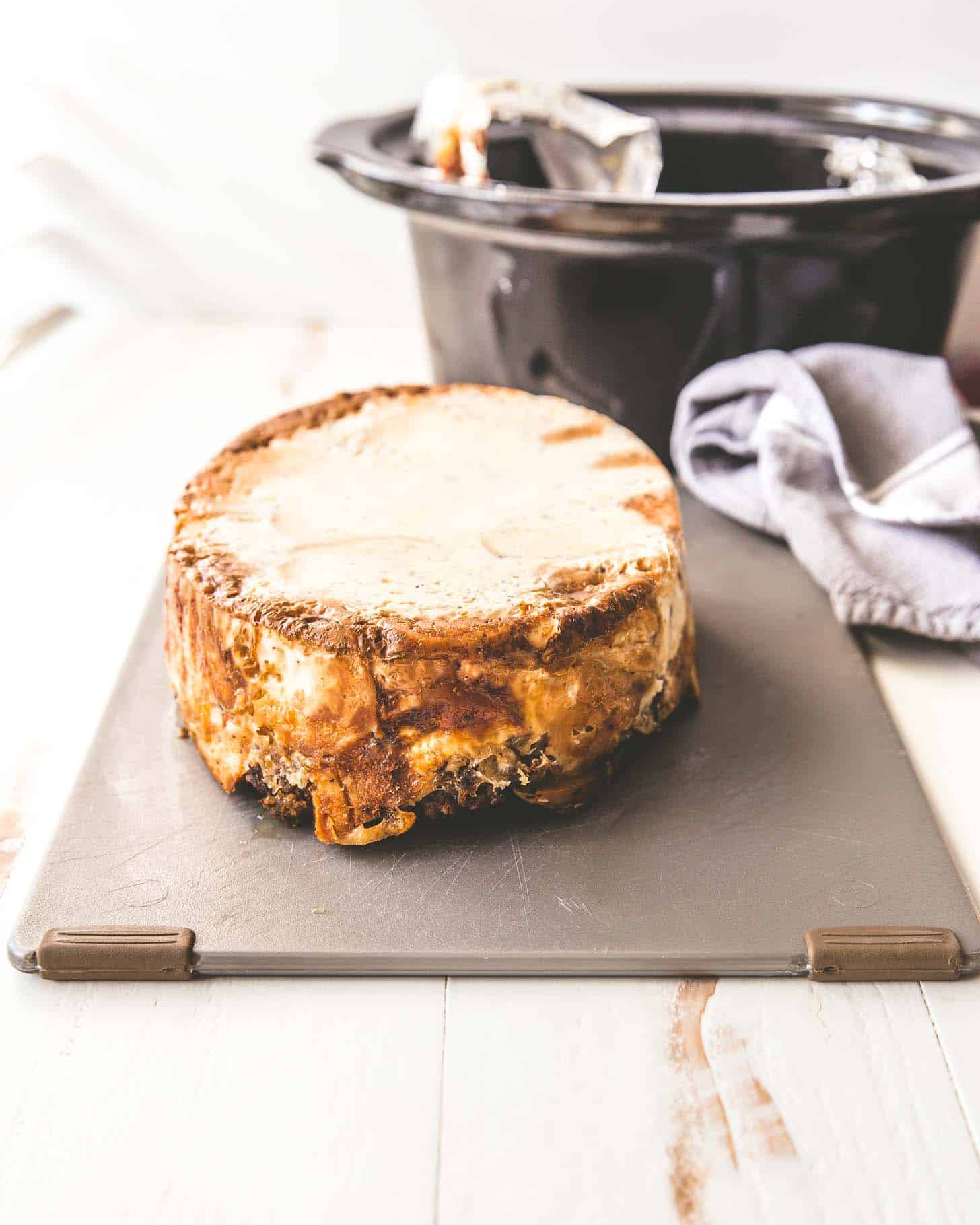 Bagel casserole upside down on a cutting board