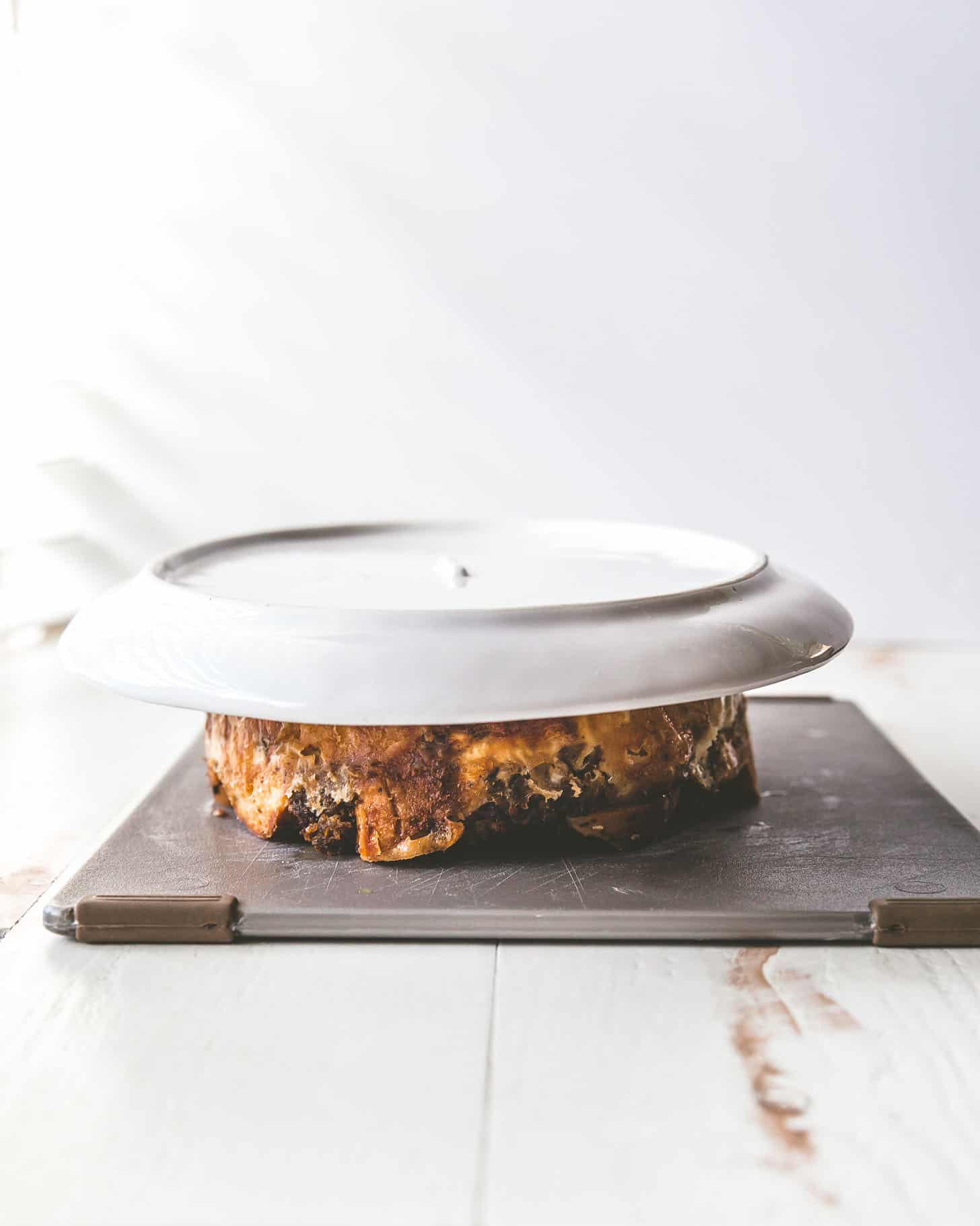 a white tray inverted on bagel casserole