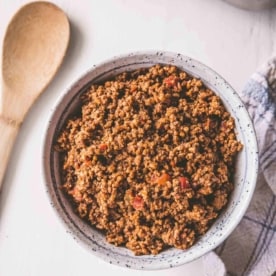 slow cooker taco meat in a white plate