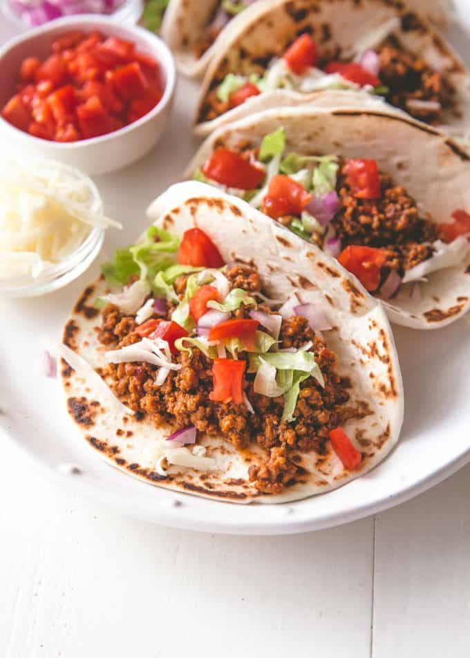 soft tacos on a white plate