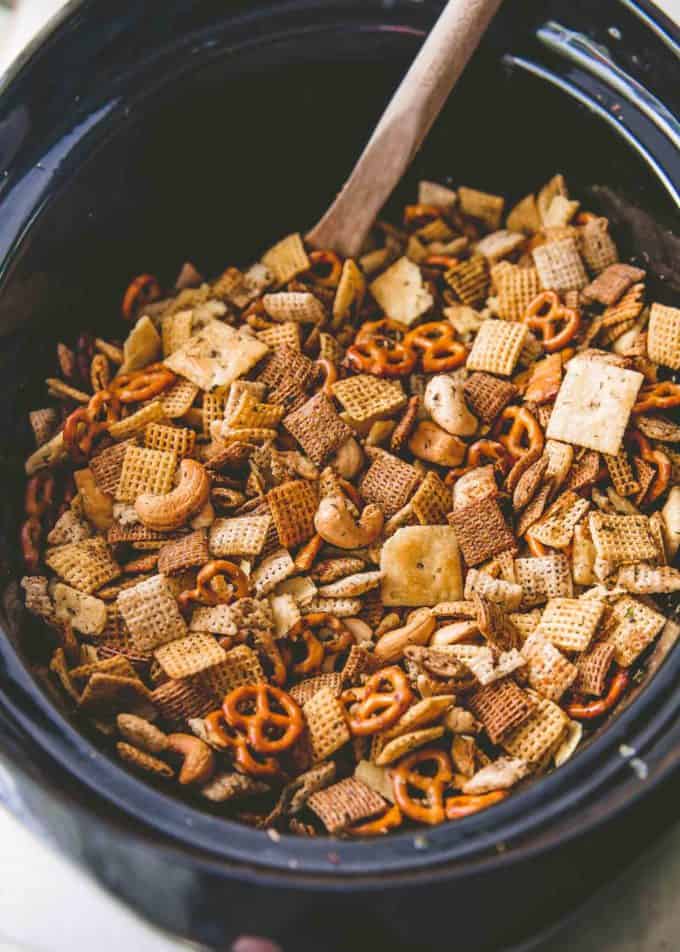 stirring ranch party mix in the slow cooker