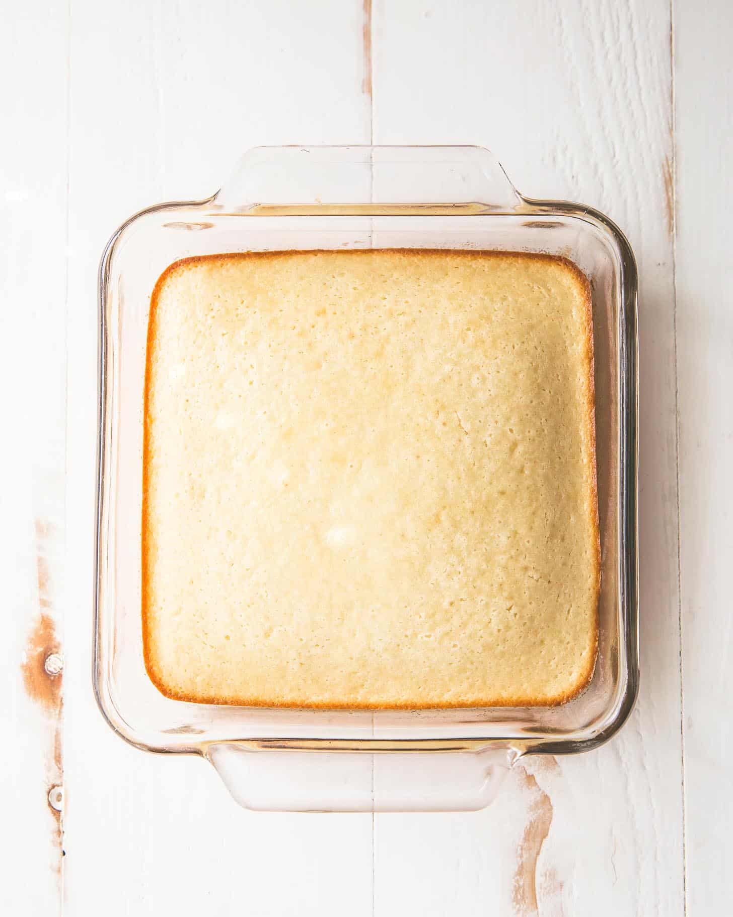 vanilla snack cake in a clear baking dish