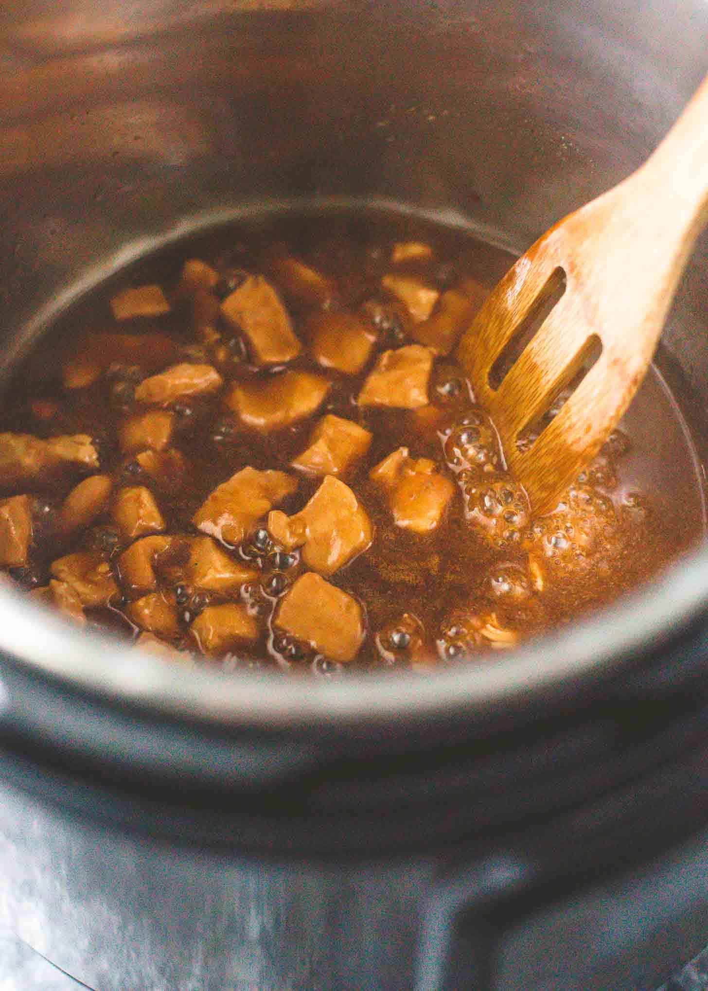 stirring kung pao chicken in the instant pot