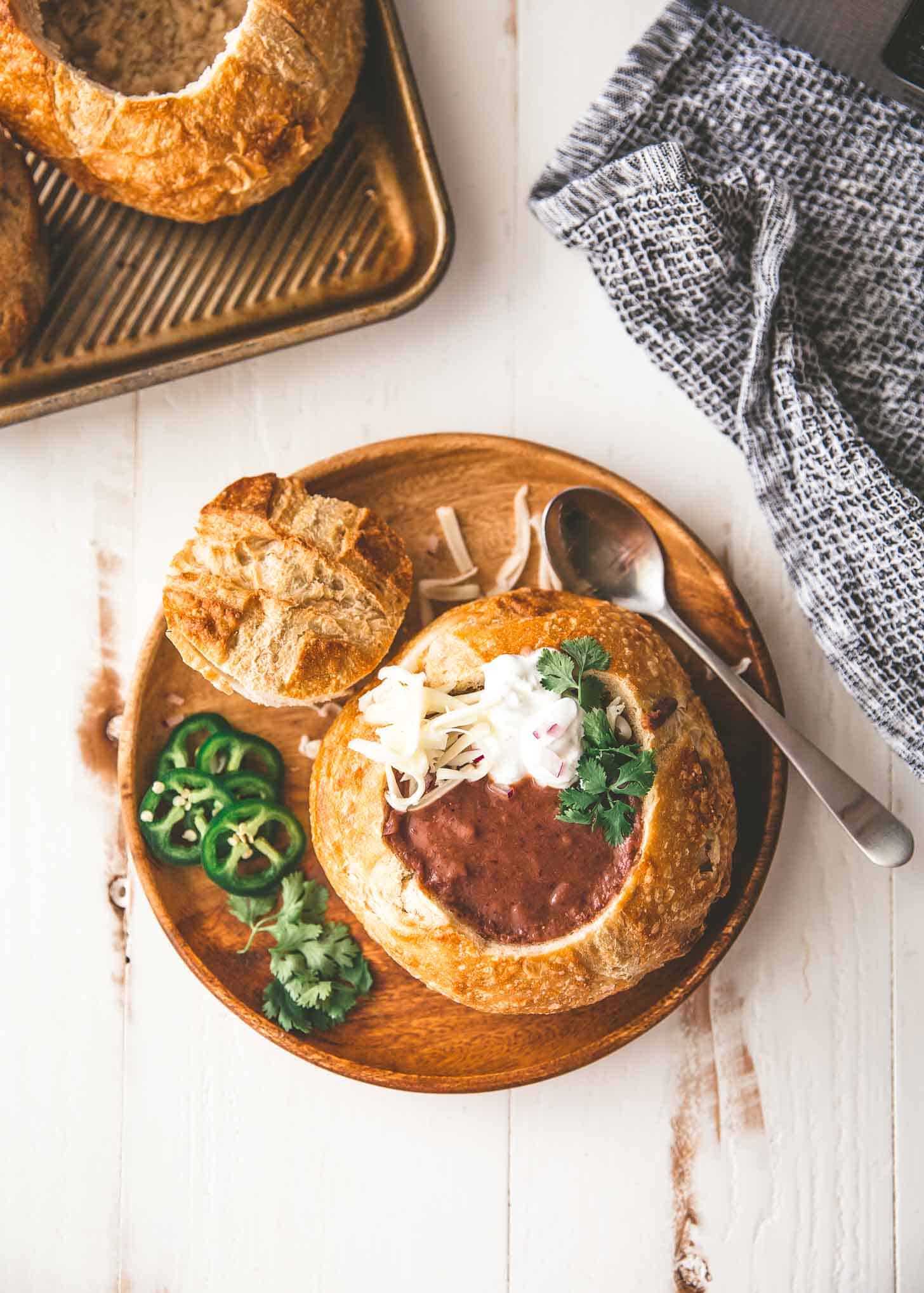 overhead image of Slow Cooker Black Bean Soup in a bread bowl