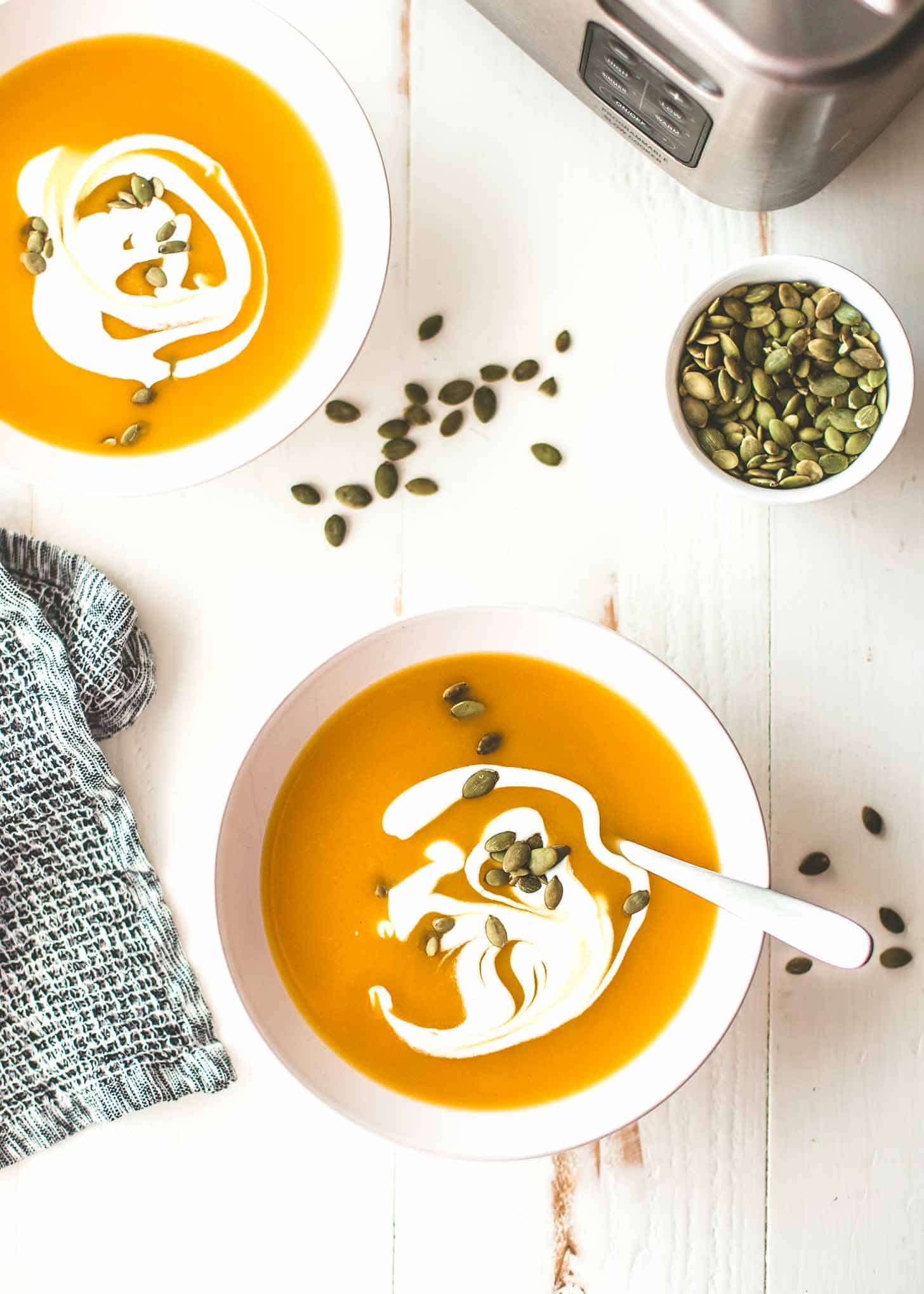 slow cooker butternut squash soup in white bowls
