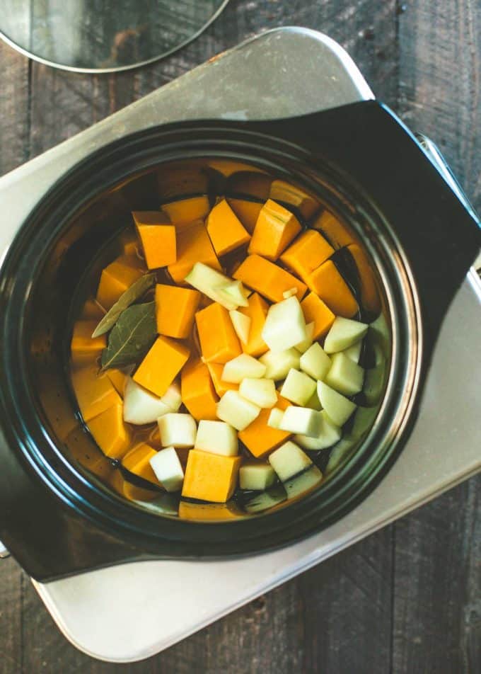 chopped vegetables in a slow cooker