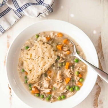 slow cooker chicken and dumplings in a white bowl