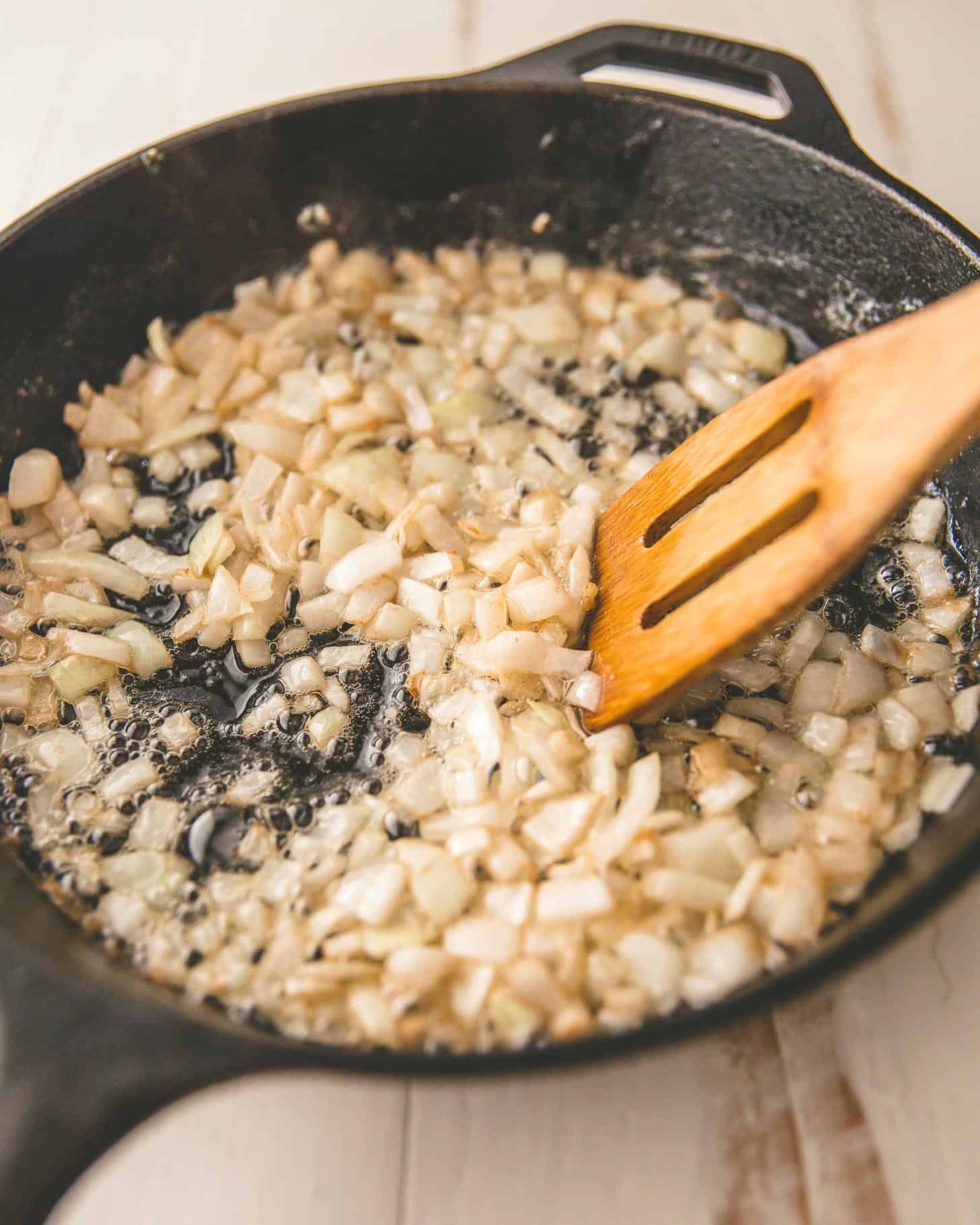 sautéing onions in a cast iron skillet