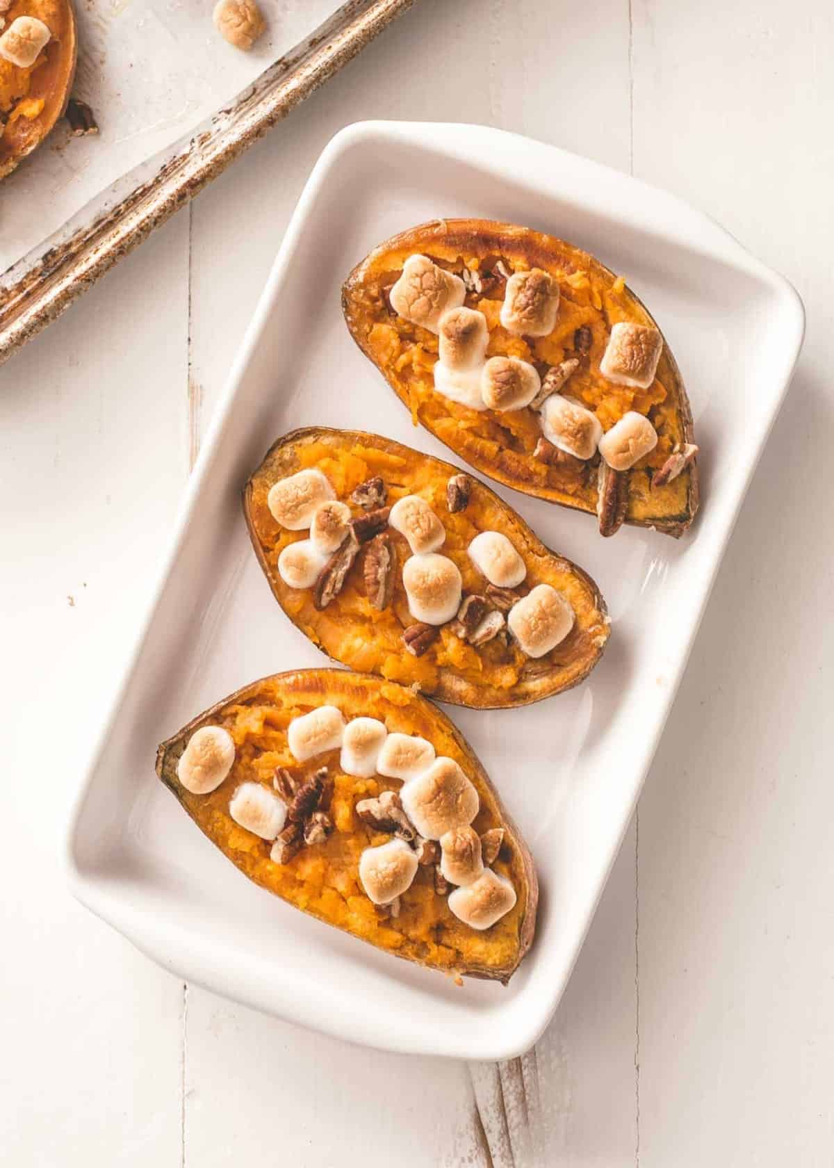 twice baked sweet potatoes in a white baking dish