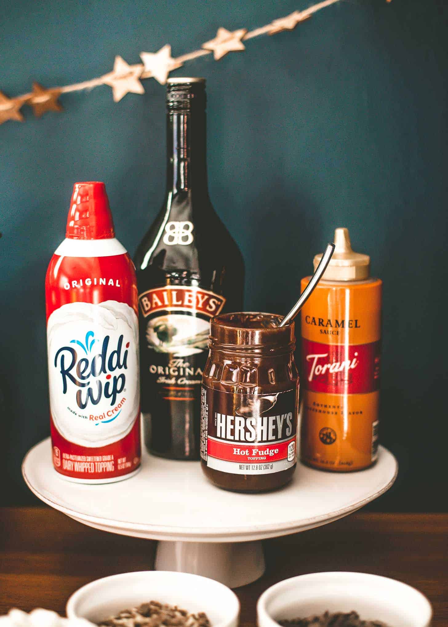 toppings for hot chocolate on a wooden bench