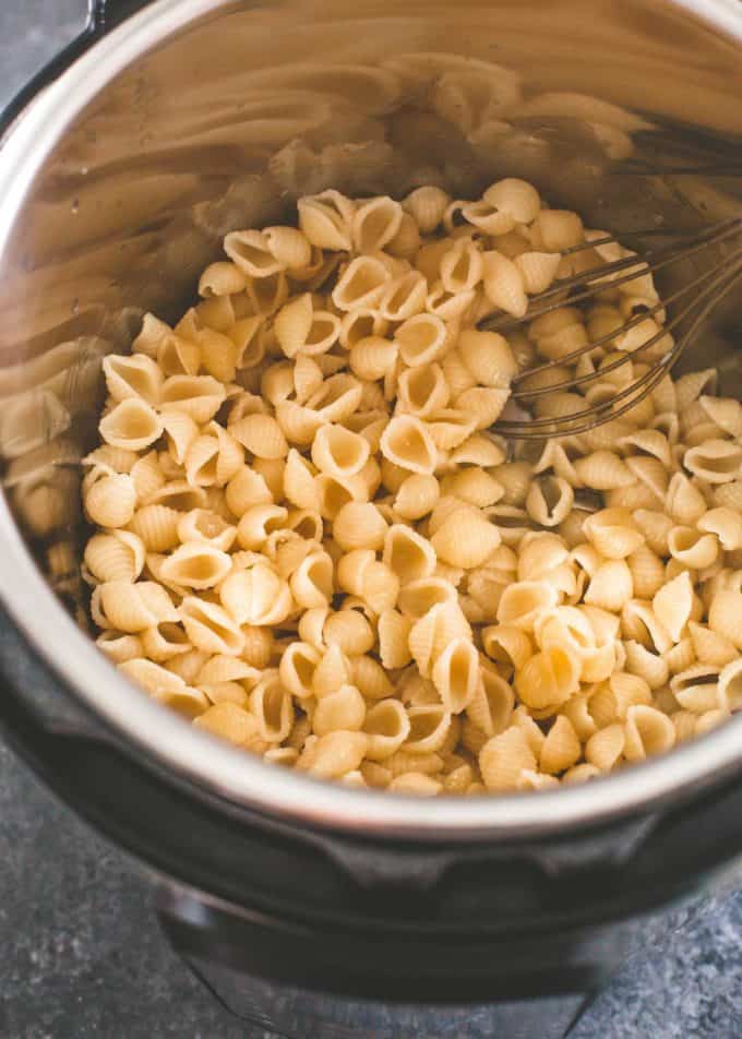 stirring pasta in an instant pot