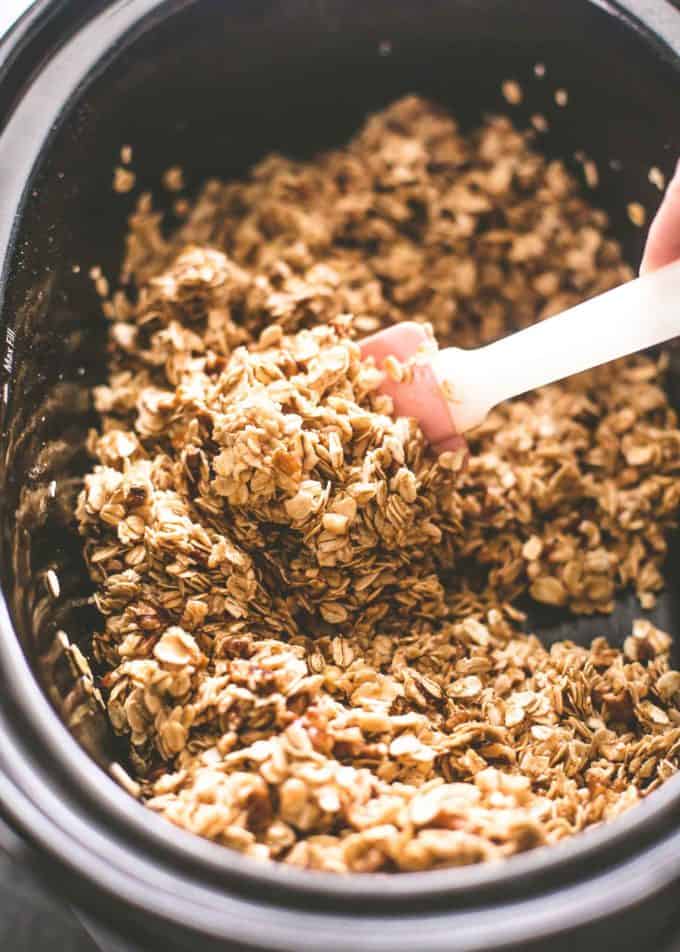 stirring granola in the slow cooker