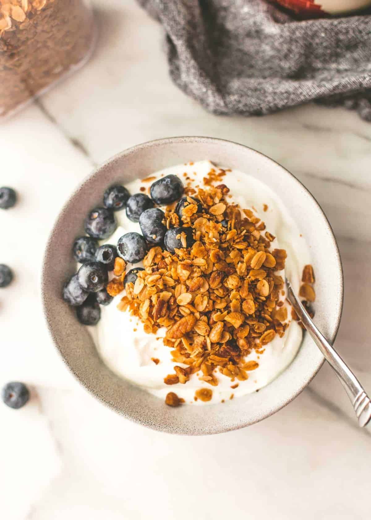 slow cooker granola in a white bowl