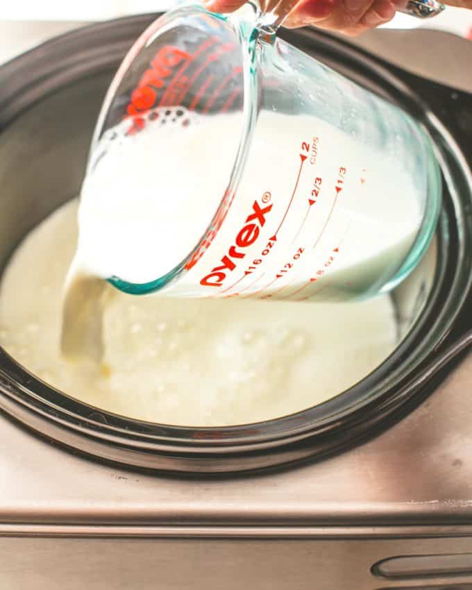 adding milk to a slow cooker