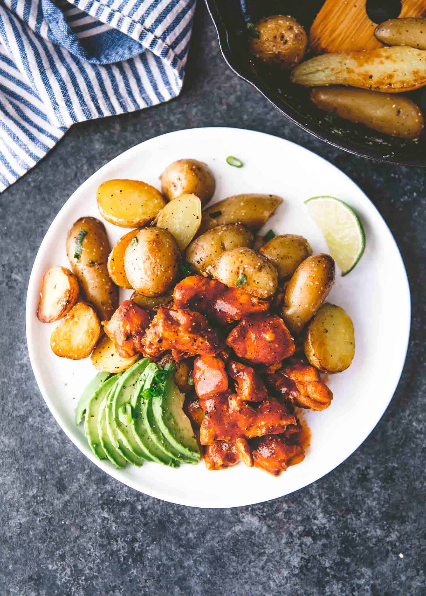 honey adobo chicken and potatoes on a white plate