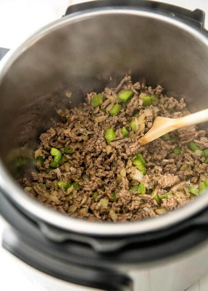 adding green peppers to ground beef in the instant pot