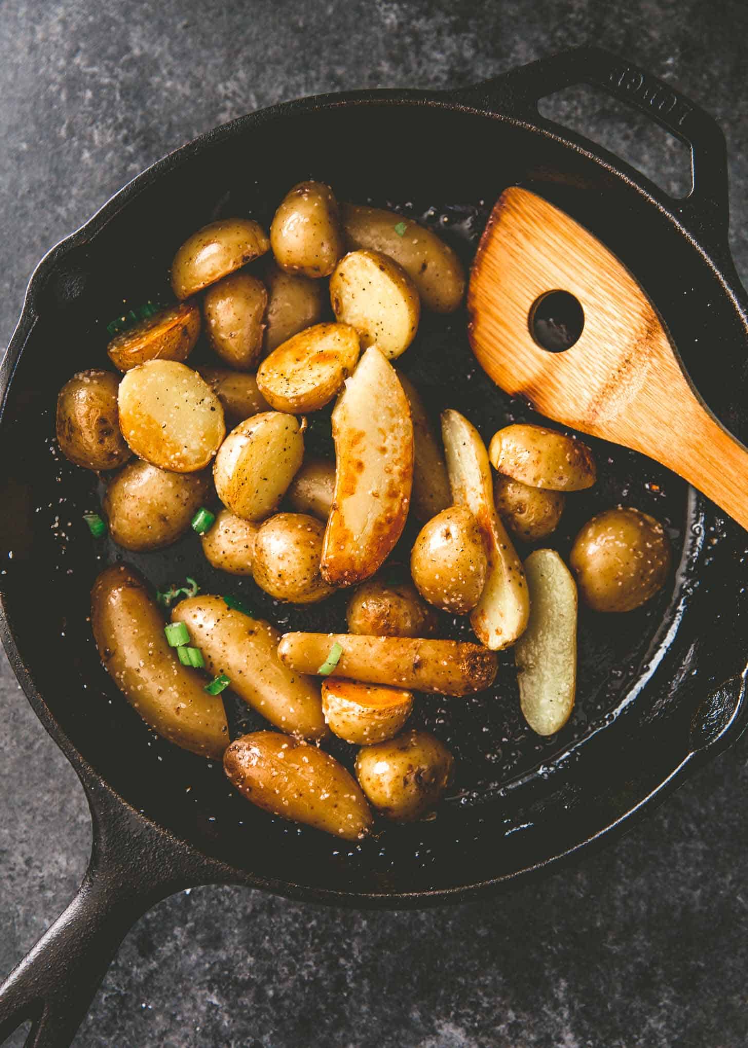 overhead image of Pan-Fried Fingerling Potatoes in a cast iron skillet