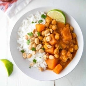 Vegetarian Thai Panang Curry over rice in a white bowl
