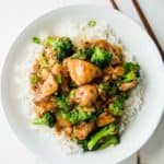 Instant Pot General Tso's Chicken over rice on a white plate