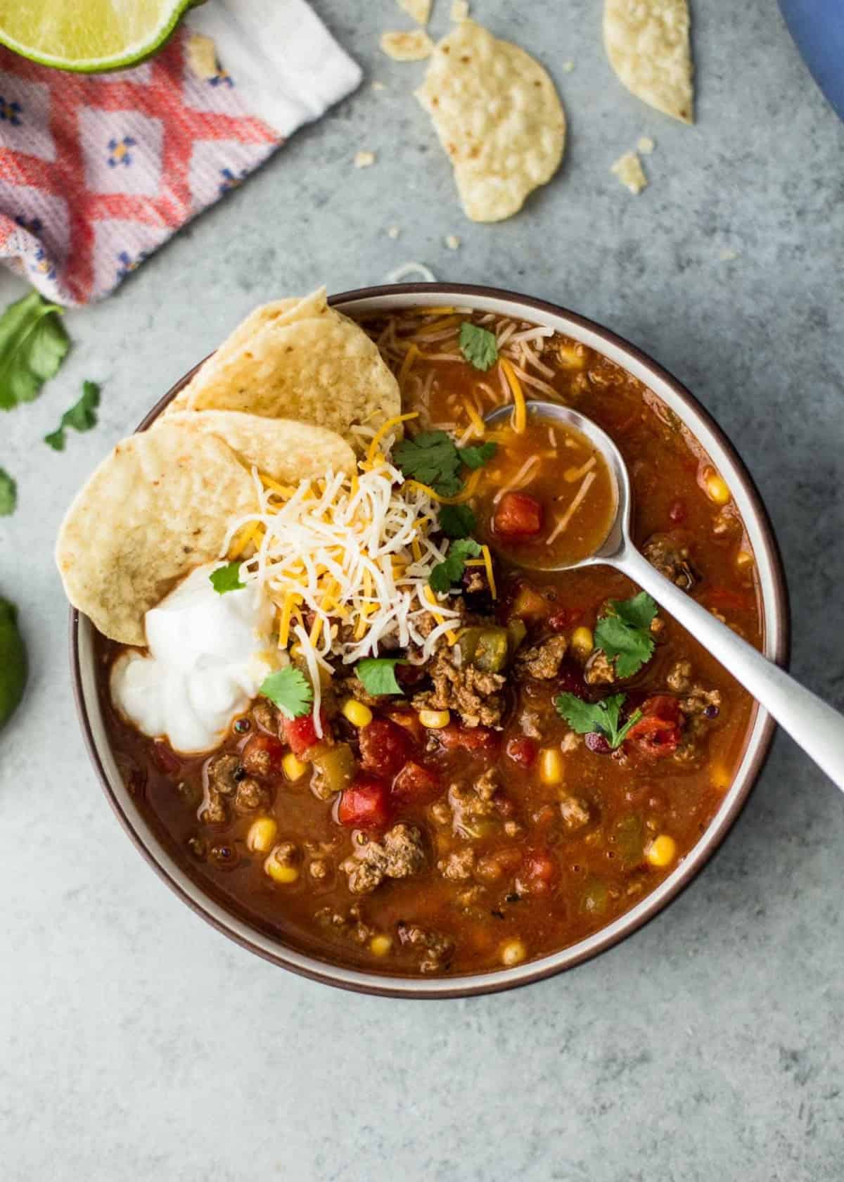 a bowl of taco soup with tortilla chips