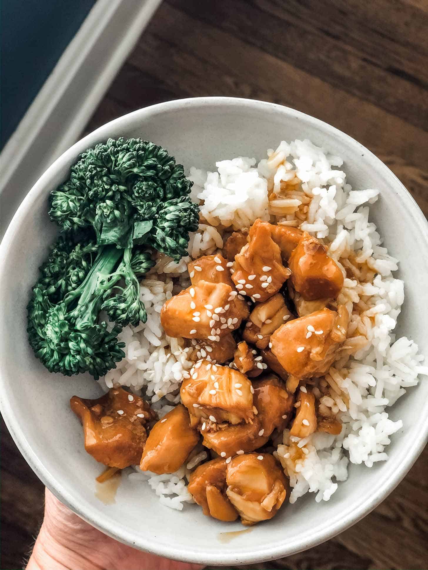 teriyaki chicken with rice in a white bowl