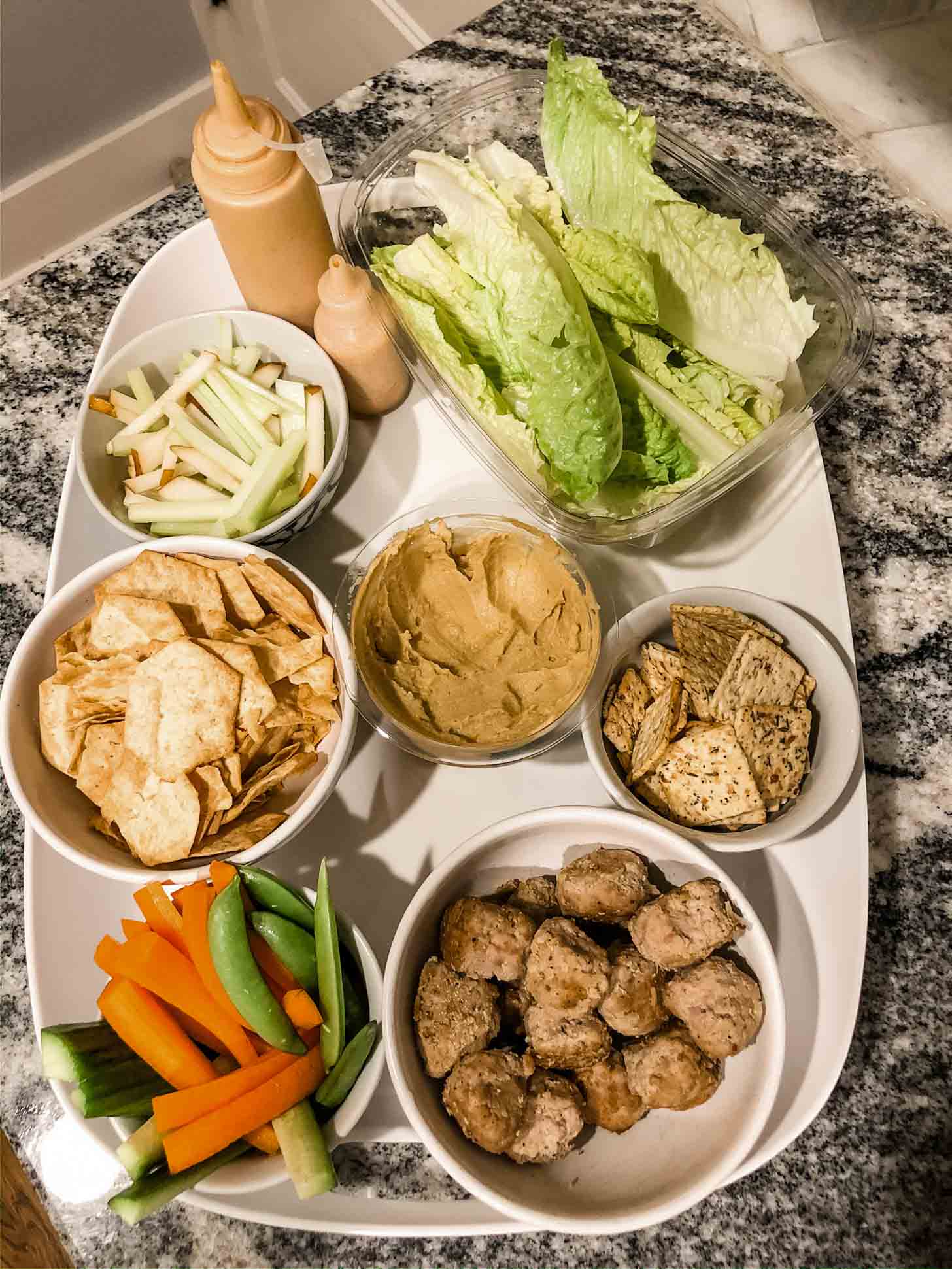 ingredients for turkey meatball lettuce cups on a white tray