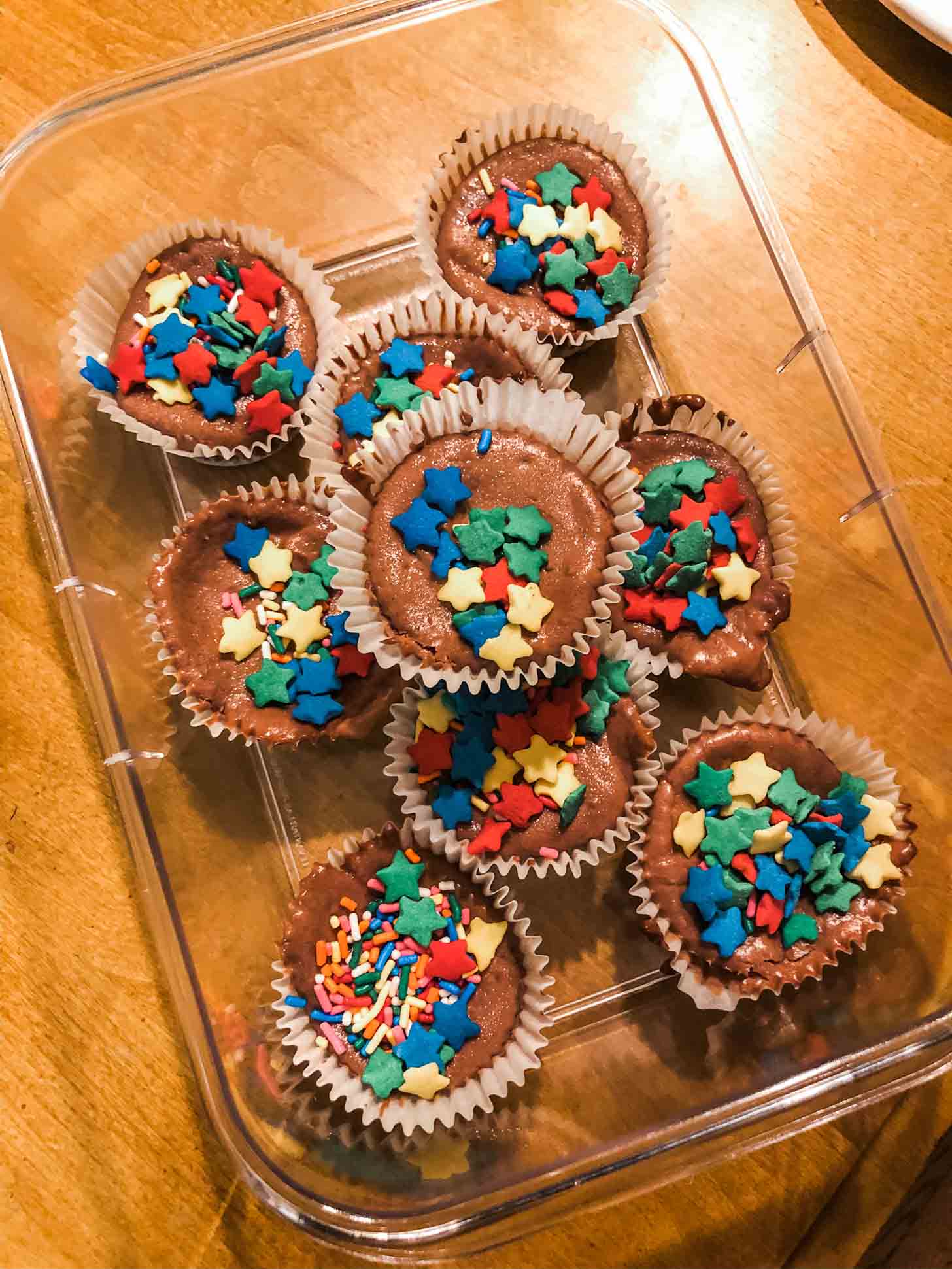 mini chocolate cheesecakes covered in star shaped sprinkles