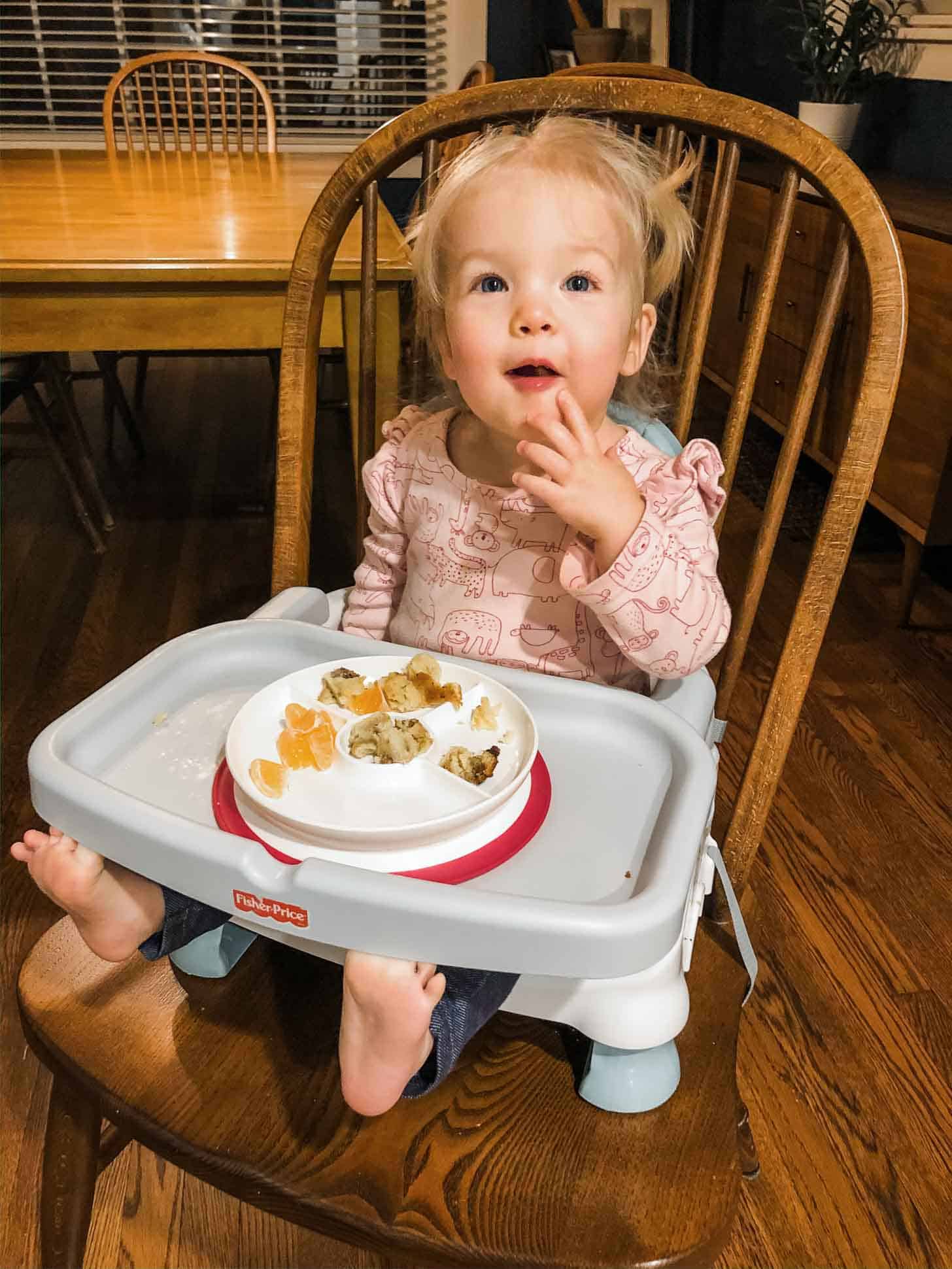 baby eating in a high chair