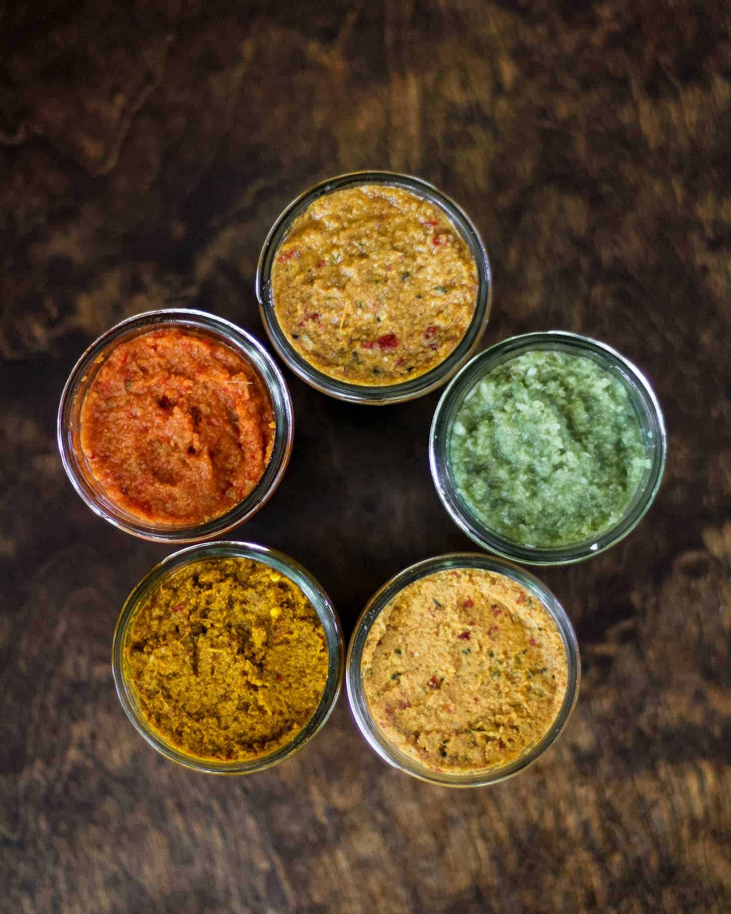 overhead image of mason jars of curry pastes