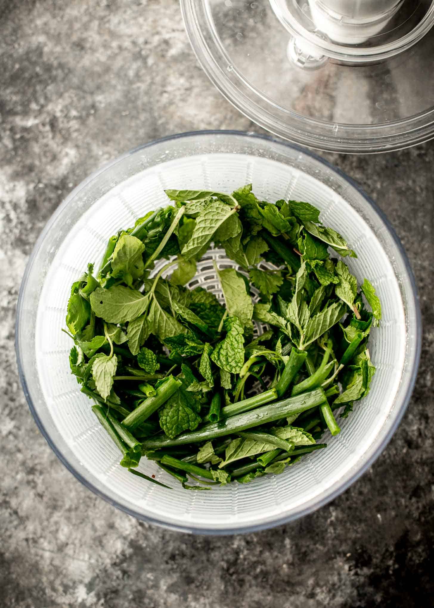 fresh herbs in a salad spinner