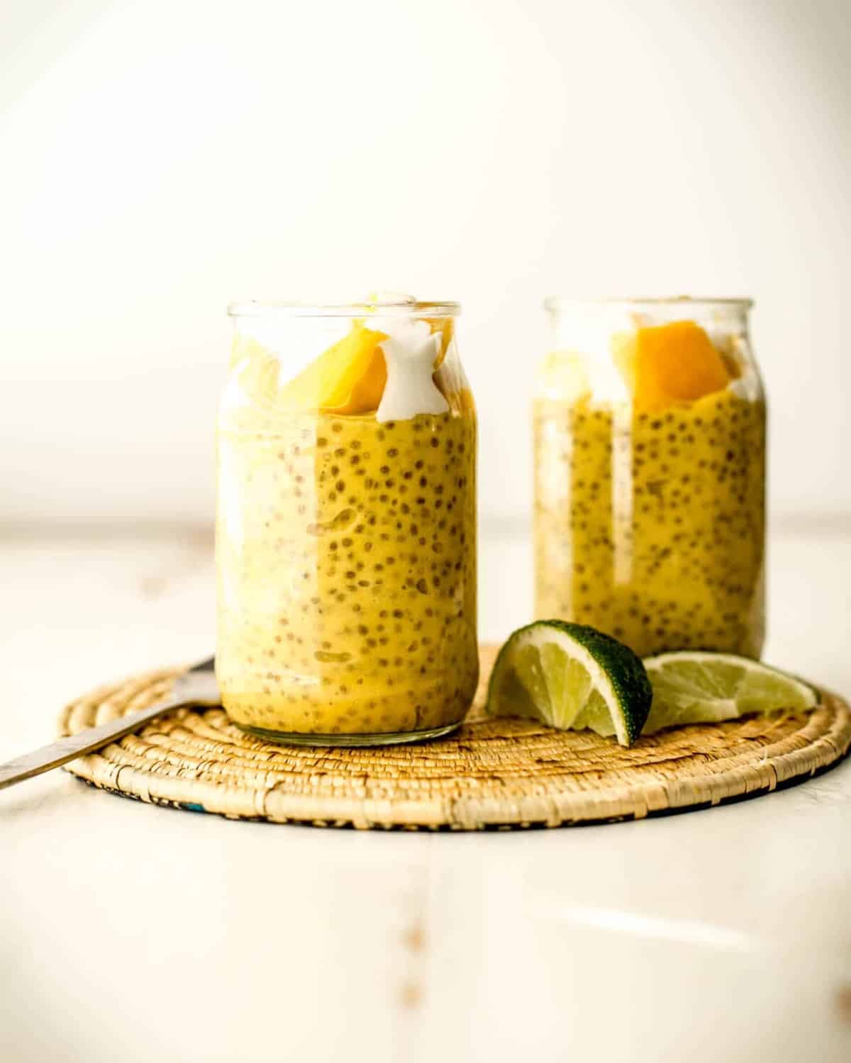 mango chia seed pudding in two glass jars