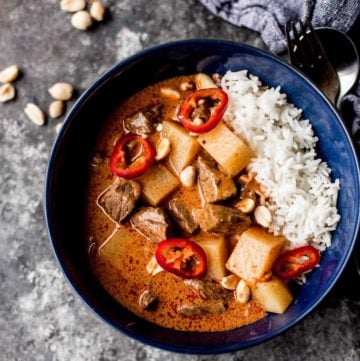 Thai Massaman Curry over rice in a blue bowl
