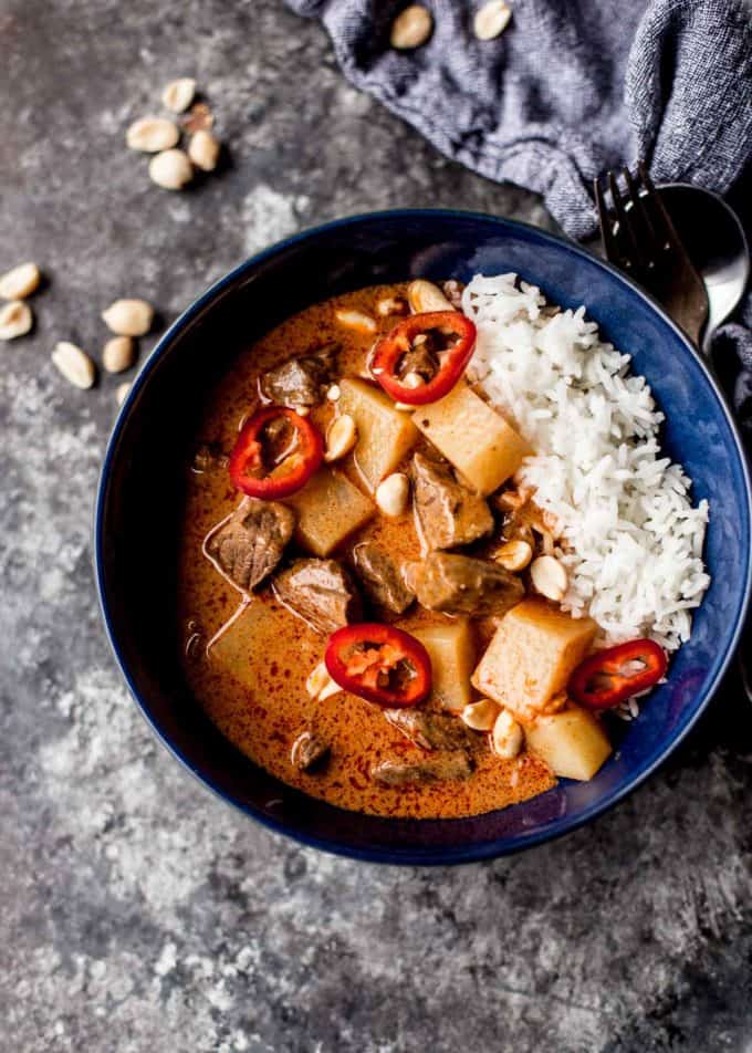 Thai Massaman Curry in a blue bowl over rice