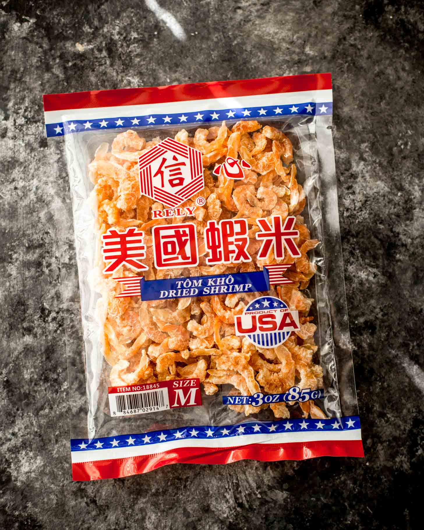 overhead image of a package of dried shrimp on a grey countertop