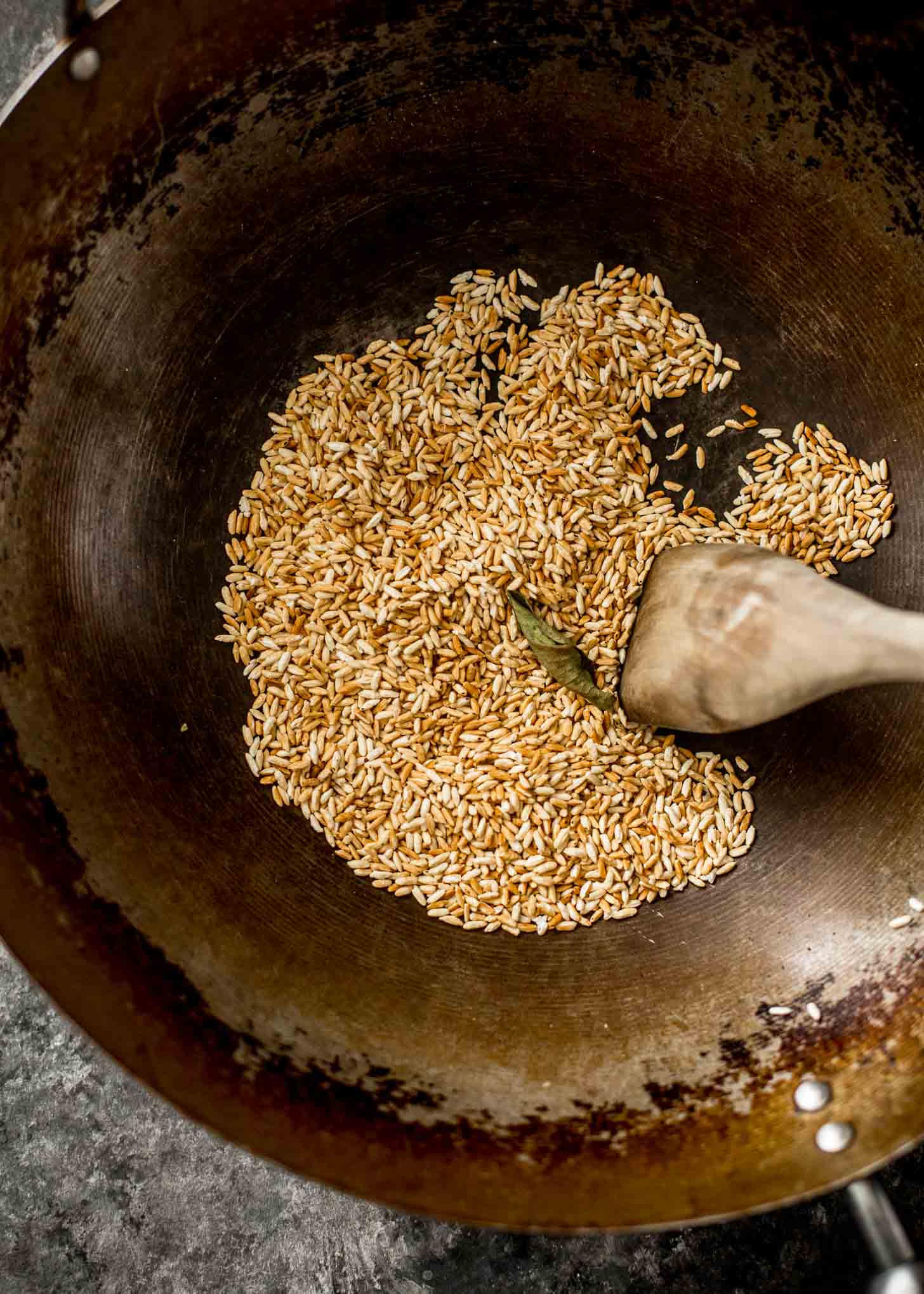 overhead image of toasting rice in a wok